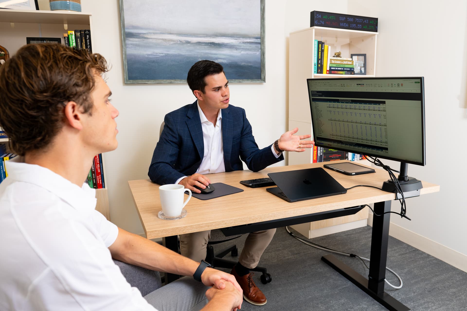 Chris Villaire building a budgeting and cash flow plan with a client in Grand Rapids, MI
